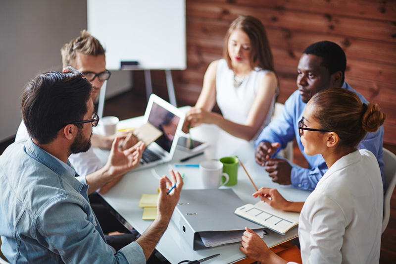 Group of People Working Together to Solve a Problem